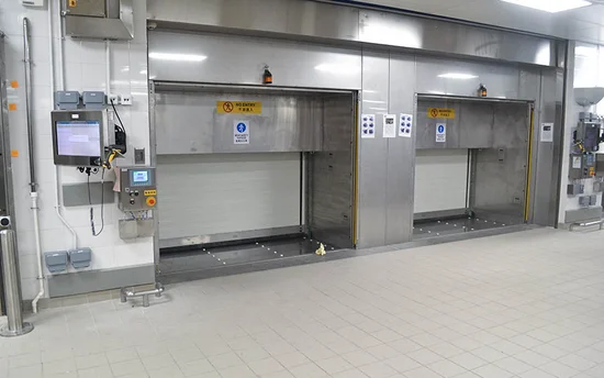 View of two automated Space Towers used for vertical storage and retrieval of catering trolleys in a flight catering logistics centre