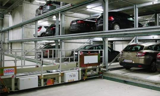 car lifts underground with cars on them