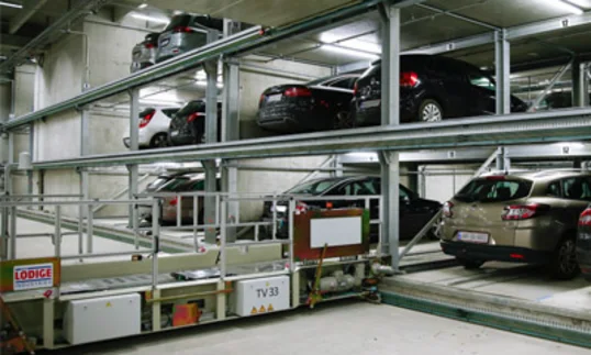 car lifts underground with cars on them