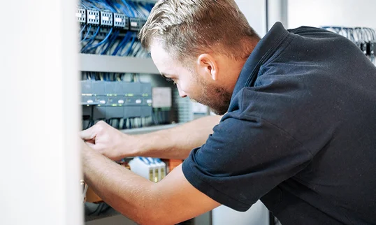 man working on some electronics